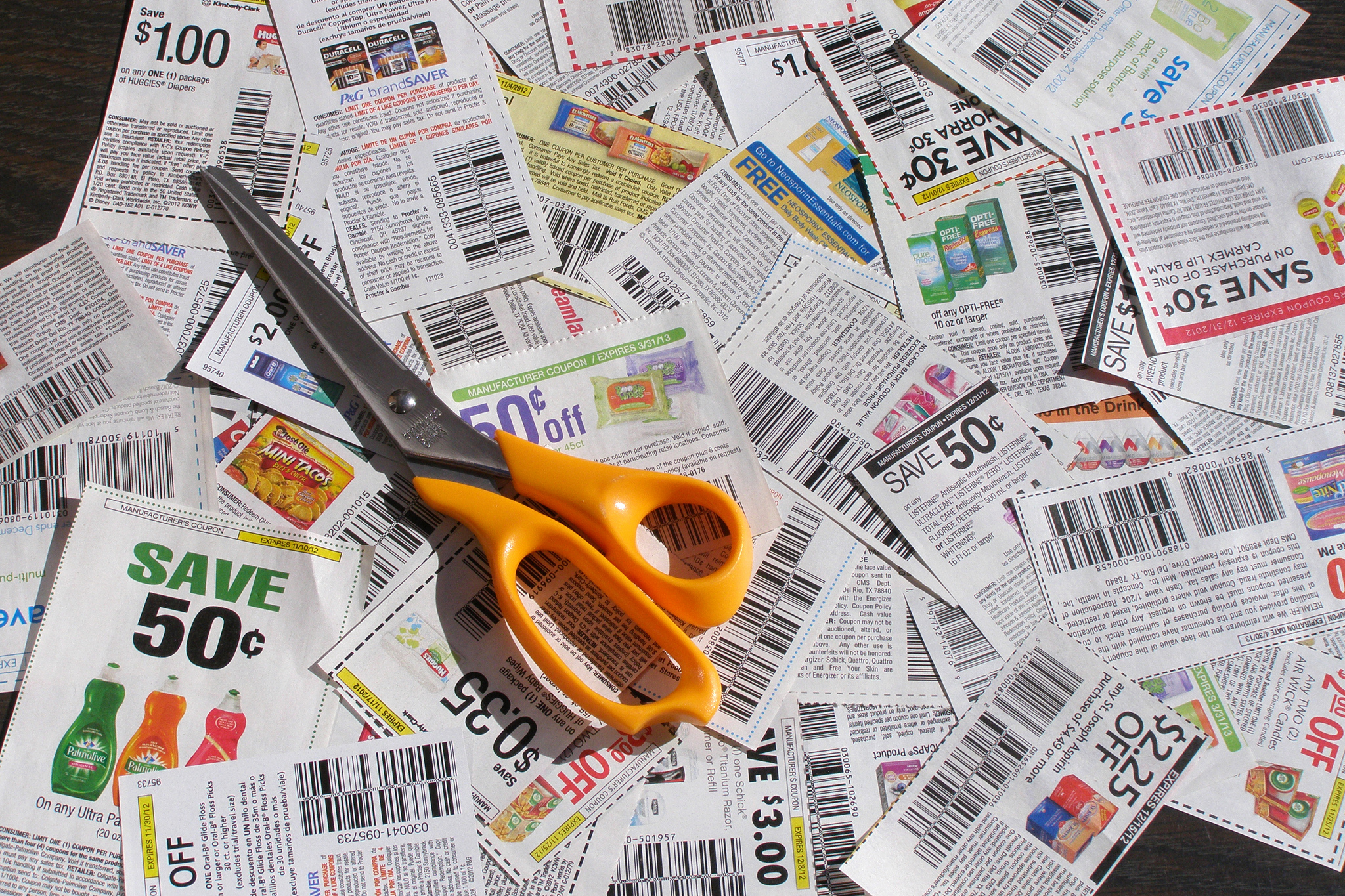 Clipping coupons with scissors